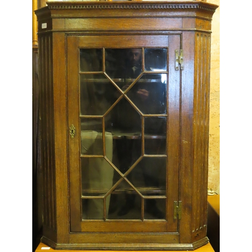 73 - Early 20th century oak single door glazed corner cabinet. Approx. 109cm H x 82cm W x 49cm D