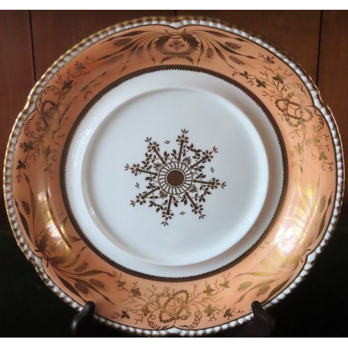 94 - Large Victorian gilded ceramic wave edged plaque. Approx. 34cms diameter