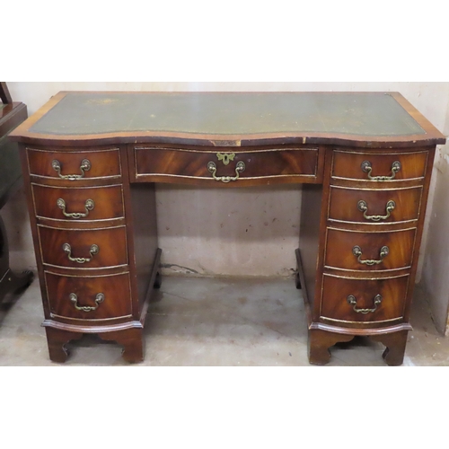 26 - Early 20th century nine drawer serpentine fronted writing desk with green leather insert. Approx. 77... 