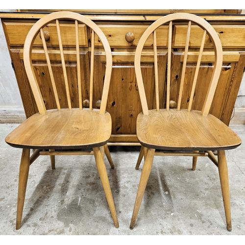 34 - Two Ercol mid 20th century stick back chairs. Approx. 87cms H