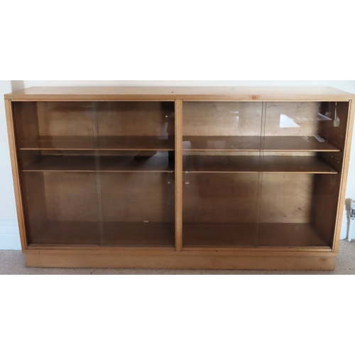 37 - 20th century light oak two door glazed bookcase. Approx. 77cm H x 137cm W x 26cm D