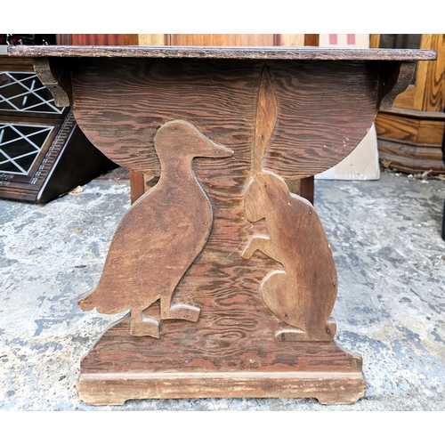 42 - Small oak child's side table with duck and a hare. Approx. 52 x 70 x 49cms