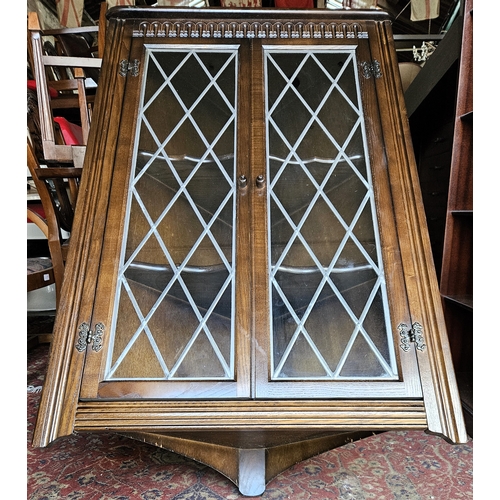 43 - 20th century dark oak two door leaded glass wall mounting corner display cabinet. Approx. 110 x 66 x... 