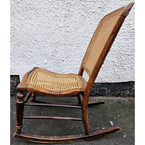 44 - Early 20th century bergere backed/seated rocking chair. Approx. 87cms