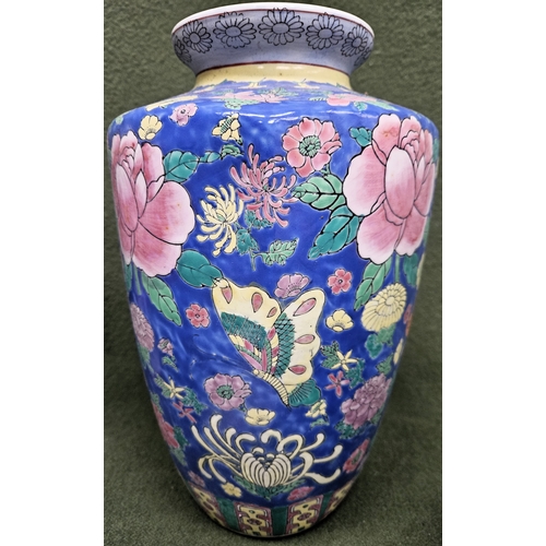 54 - Oriental floral decorated polychrome ceramic vase. Approx. 31cms H