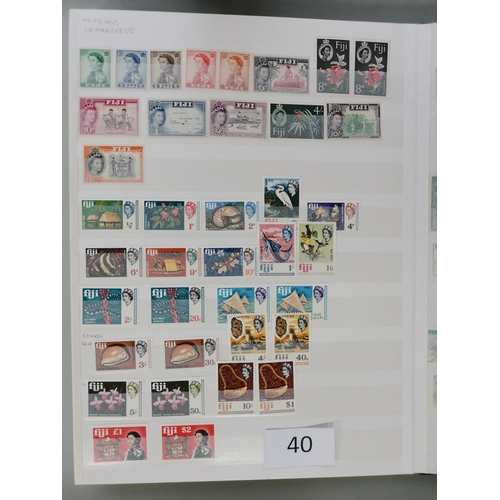 40 - MIXED WORLD.  A collection in 3 stockbooks and envelope  mostly QE with much UM incl. defin sets etc... 