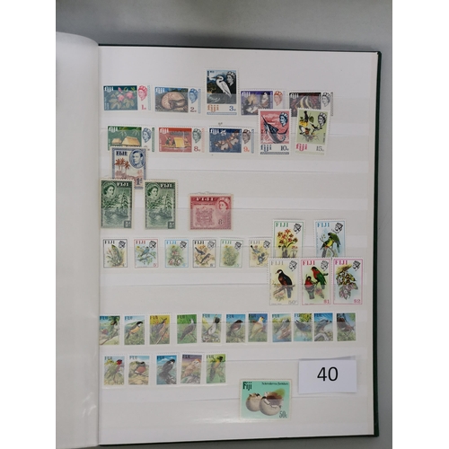 40 - MIXED WORLD.  A collection in 3 stockbooks and envelope  mostly QE with much UM incl. defin sets etc... 