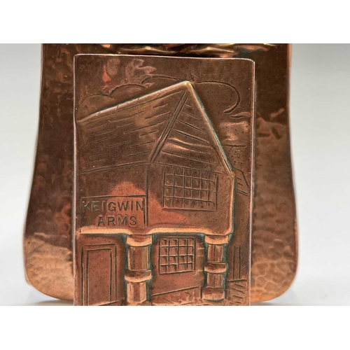 10 - A Herbert Dyer (1898-1974) copper wall mounted matchbox holder, the plaque repousse decorated with a... 