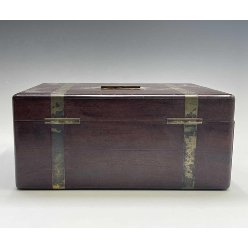 11 - An early Victorian mahogany and brass campaign Gentleman's toilet box, the red Morocco leather and v... 