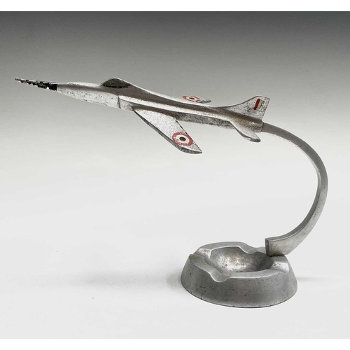 117 - An aluminium ashtray, modelled with a fighter jet, height 15.5cm, together with a cast plaque for Wa... 