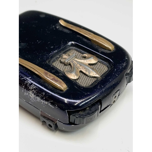 123 - A vintage Ardente hearing aid, with tinned case, height 9cm, together with a brass cased aneroid bar... 