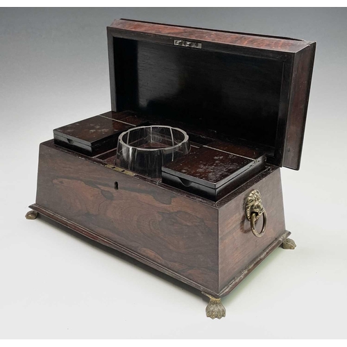 13 - A Regency rosewood tea caddy, of sarcophagus shape, with a glass mixing bowl and two lidded containe... 