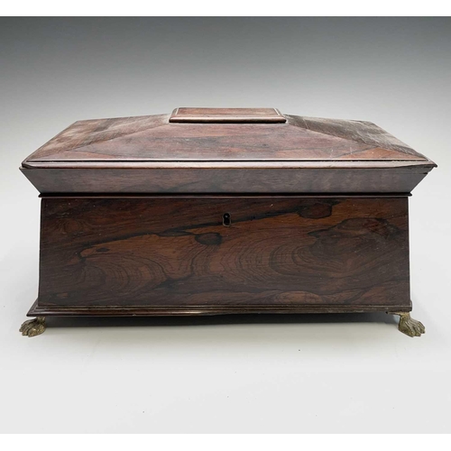 13 - A Regency rosewood tea caddy, of sarcophagus shape, with a glass mixing bowl and two lidded containe... 