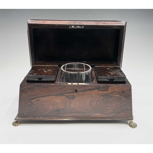 13 - A Regency rosewood tea caddy, of sarcophagus shape, with a glass mixing bowl and two lidded containe... 