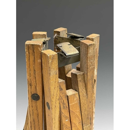 135 - An ash and brass folding tripod, early 20th century, together with parts of two other tripods.