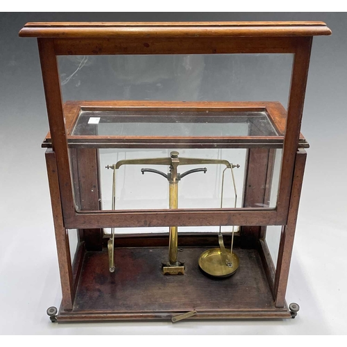 143 - A brass precision laboratory balance, by W & T Avery Ltd, circa 1900, contained in a glazed mahogany... 