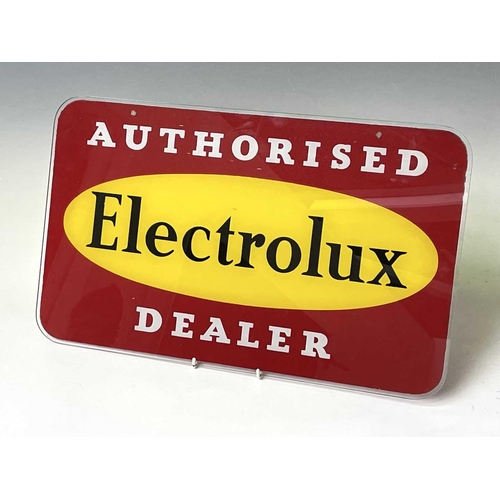 145 - A 1960s glass advertising plaque 'Authorised Electrolux Dealer', 31X51cm.