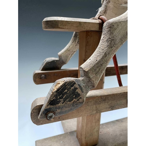 146 - A pine and painted rocking horse, circa 1930, height 85cm, width 92cm, depth 34cm.