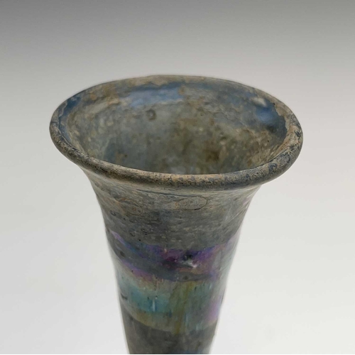 15 - Three iridescent glass vessels, possibly Roman, comprising a ewer, height 13cm, and two vases. Prove... 