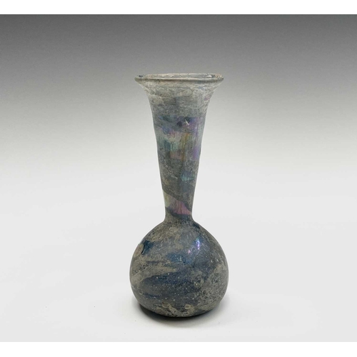 15 - Three iridescent glass vessels, possibly Roman, comprising a ewer, height 13cm, and two vases. Prove... 