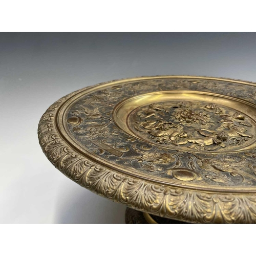 16 - A gilt metal comport, Continental, 19th century, embossed in high relief with cherubs to the centre,... 