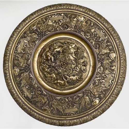 16 - A gilt metal comport, Continental, 19th century, embossed in high relief with cherubs to the centre,... 