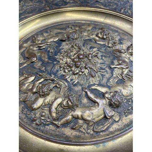 16 - A gilt metal comport, Continental, 19th century, embossed in high relief with cherubs to the centre,... 