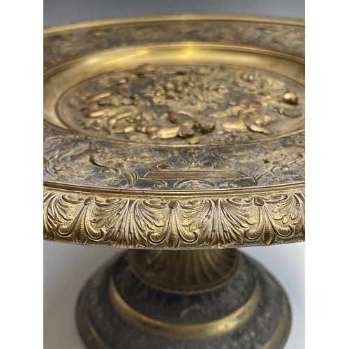 16 - A gilt metal comport, Continental, 19th century, embossed in high relief with cherubs to the centre,... 