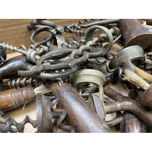 163 - A large collection of corkscrews, many 19th century, including some with brushes, folding bow type a... 