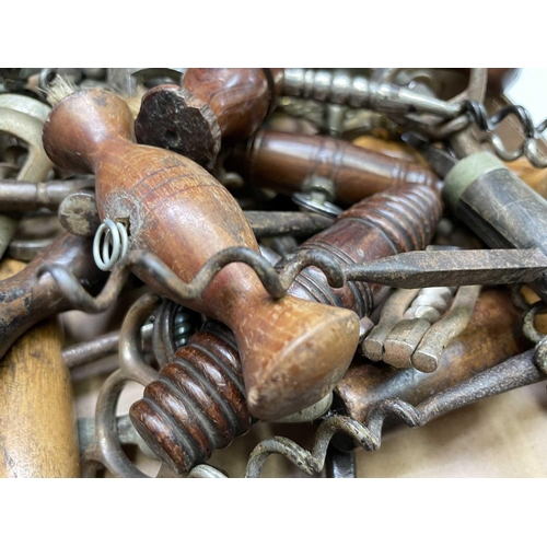 163 - A large collection of corkscrews, many 19th century, including some with brushes, folding bow type a... 