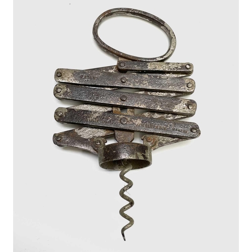 163 - A large collection of corkscrews, many 19th century, including some with brushes, folding bow type a... 