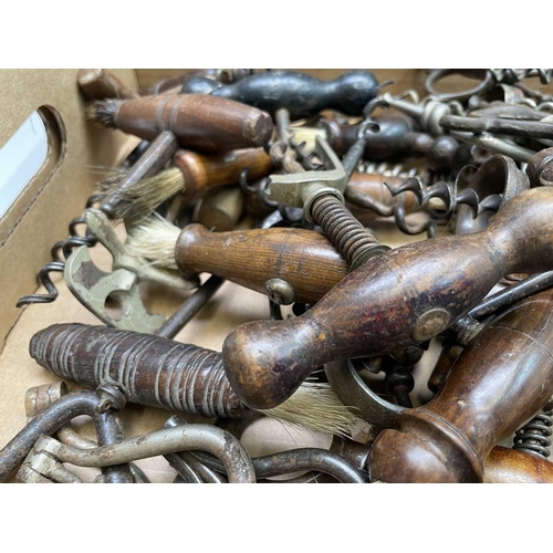 163 - A large collection of corkscrews, many 19th century, including some with brushes, folding bow type a... 