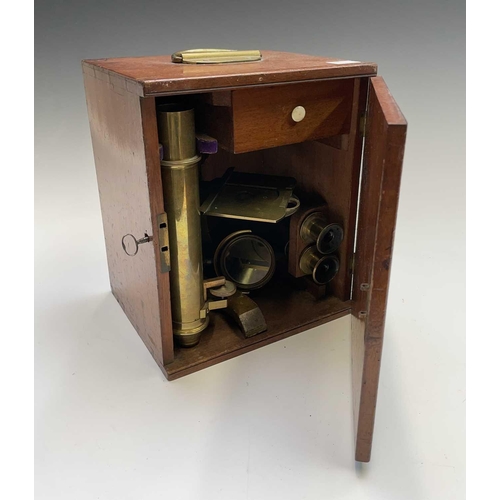 164 - A late Victorian brass microscope, with lenses, contained in a mahogany case with fitted drawer, ove... 