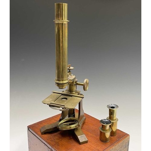 164 - A late Victorian brass microscope, with lenses, contained in a mahogany case with fitted drawer, ove... 