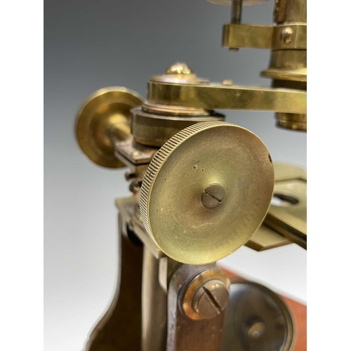 164 - A late Victorian brass microscope, with lenses, contained in a mahogany case with fitted drawer, ove... 