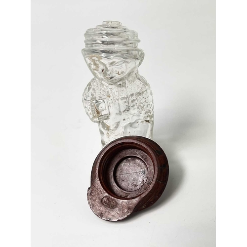 167 - A 1920s perfume bottle, moulded as a small boy, the cover modelled as a bakelite cap, height 8cm, to... 