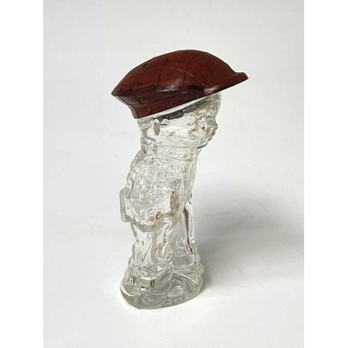 167 - A 1920s perfume bottle, moulded as a small boy, the cover modelled as a bakelite cap, height 8cm, to... 