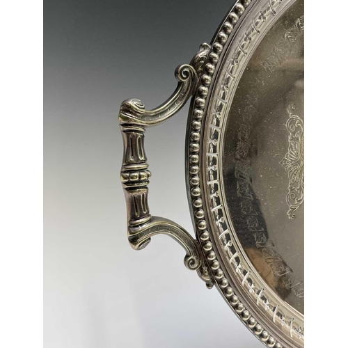 173 - A late Victorian silver plated oval tray, engraved with foliate roundels and festoons, with pierced ... 