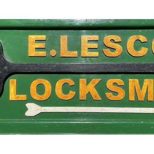 175 - A Locksmith's sign, mid 20th century, for E.Lescot, mounted with an oversize steel key, height 45cm,... 