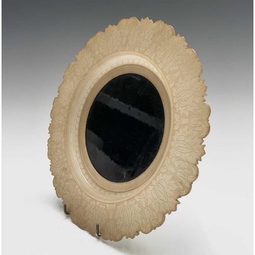 177 - An alabaster circular dish, possibly Indian, 19th century, with shaped and leaf carved border, with ... 