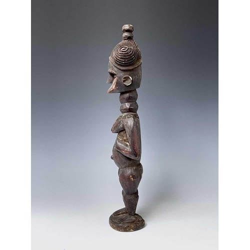 181 - A carved wood South Sea island figure. Height 59.5cm.