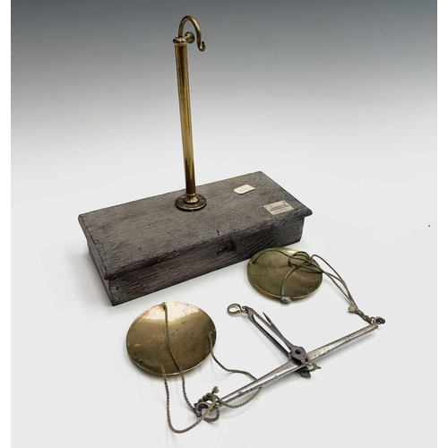 185 - A set of brass and steel traveling jewellers scales, late 19th century, with weights, contained in a... 