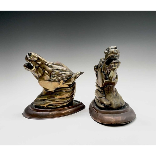 188 - A pair of brass horses' masks raised on copper wall mounts. Height 19cm, width 11.5cm, depth 18.5cm.