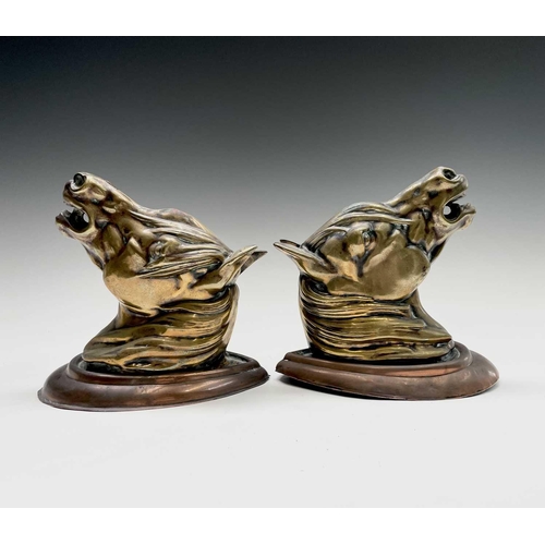 188 - A pair of brass horses' masks raised on copper wall mounts. Height 19cm, width 11.5cm, depth 18.5cm.