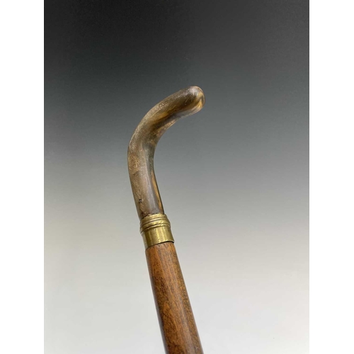 190 - A middle Eastern swordstick, with horn handle, length 96cm, together with an African leather covered... 