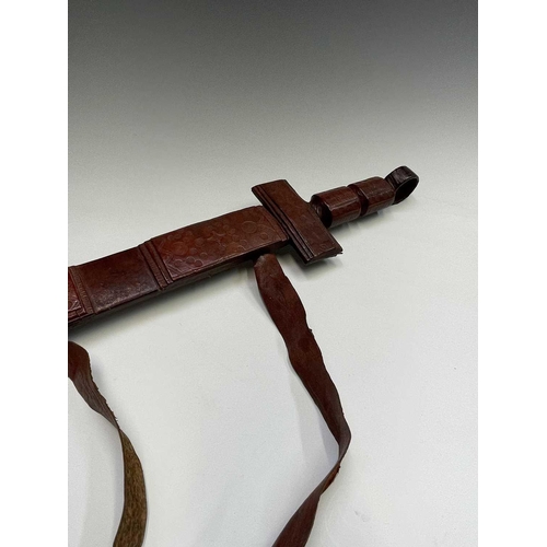 190 - A middle Eastern swordstick, with horn handle, length 96cm, together with an African leather covered... 