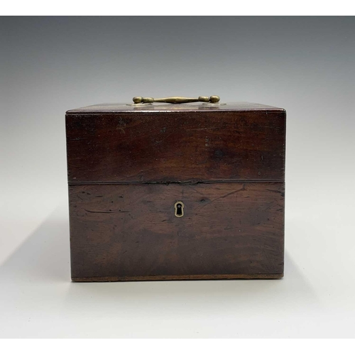 196 - A George III mahogany spirit decanter box of cubed form with brass carrying handle, enclosing two de... 