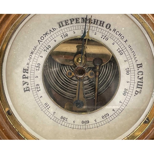 206 - An aneroid barometer, contained in a Cornish serpentine circular case, diameter 17cm, together with ... 