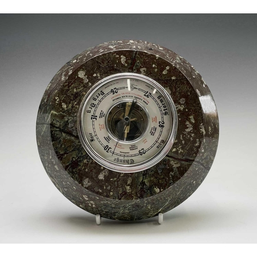 206 - An aneroid barometer, contained in a Cornish serpentine circular case, diameter 17cm, together with ... 