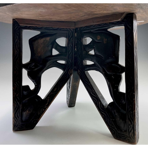 208 - An African circular hardwood occasional table, the top carved with an elephant, eagle, antelope, tor... 